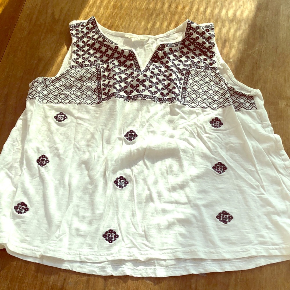 White tank with blue pattern on front